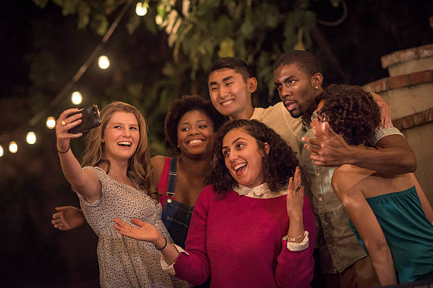 istock Hipsters Taking a Selfie at a Summer Backyard BBQ 621603350