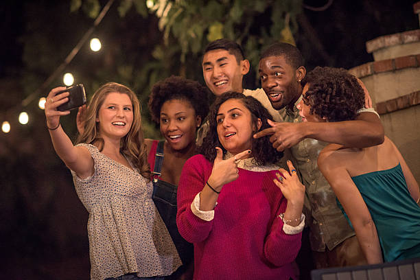 istock Hipsters Taking a Selfie at a Summer Backyard BBQ 621603632