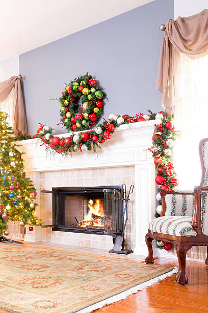 istock Festive Christmas fireplace with wreath 621604210