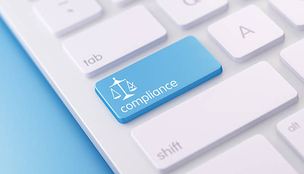 Modern Keyboard wih Blue Compliance Button High quality 3d render of a modern keyboard with blue compliance button on a blue background and copy space. Blue compliance keyboard button has a text and an icon on it. Compliance keyboard button is in focus, Horizontal composition with copy space. compliance stock pictures, royalty-free photos & images