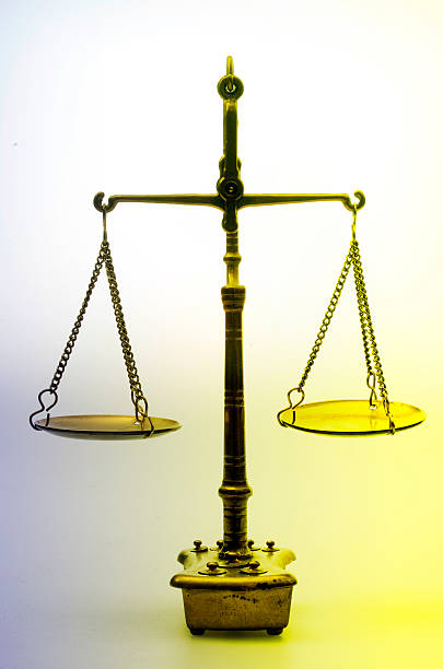 istock Mechanical golden weight scale, also laboratory balance 621605116