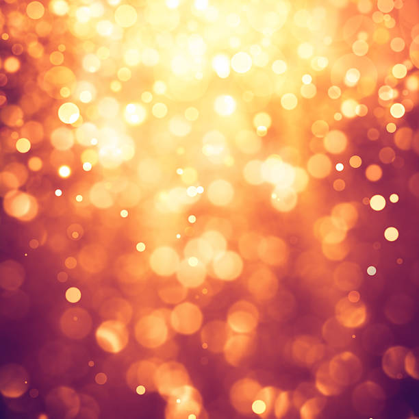 Gold defocused lights and sparkles background