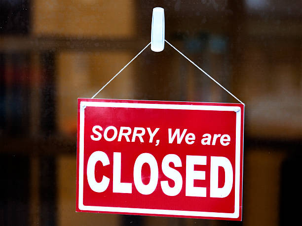 istock Closed Sign in a Shop Window 621606966