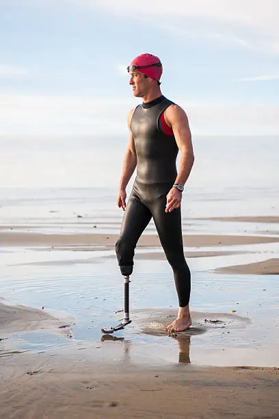 Photo of Silhouette Of Athlete With Prosthetic Leg On The Beach