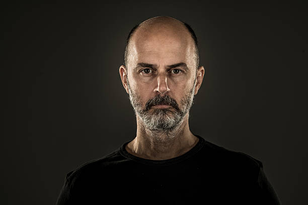 istock unshaven stern man 621609086