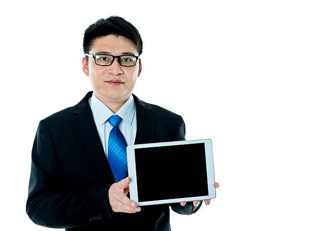 istock Young asian businessman holding digital tablet 621609772