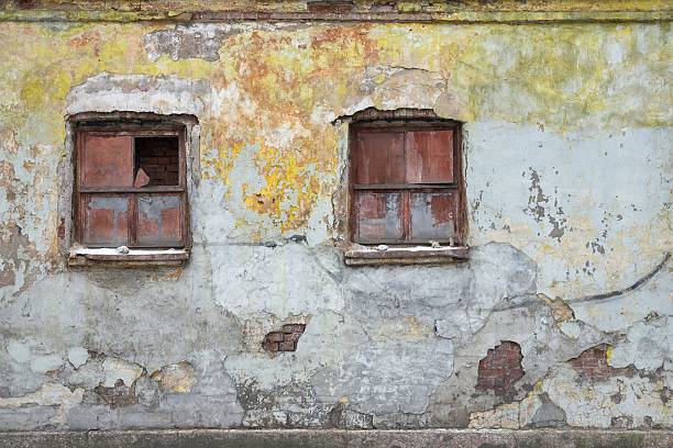 istock wall with windows of the old house or building 621610118