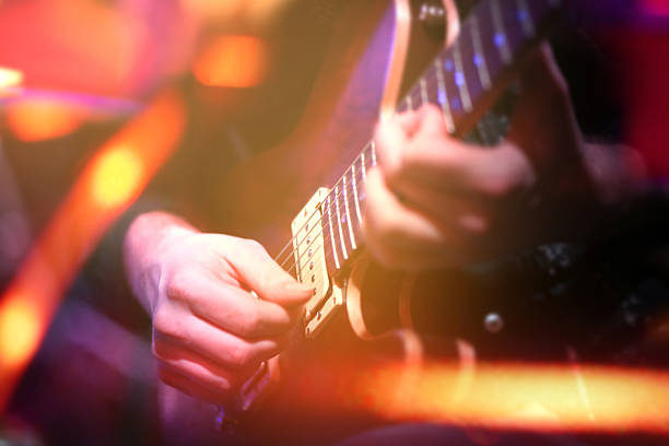 istock Playing electric guitar in concert 621610490
