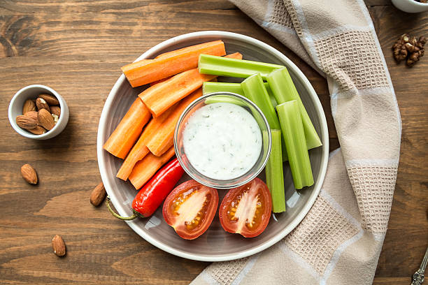 istock Vegetarian healthy snacks, vegetable snack: carrots, celery, tom 621611158