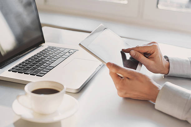 istock Place of work, man using tablet and laptop 621613832