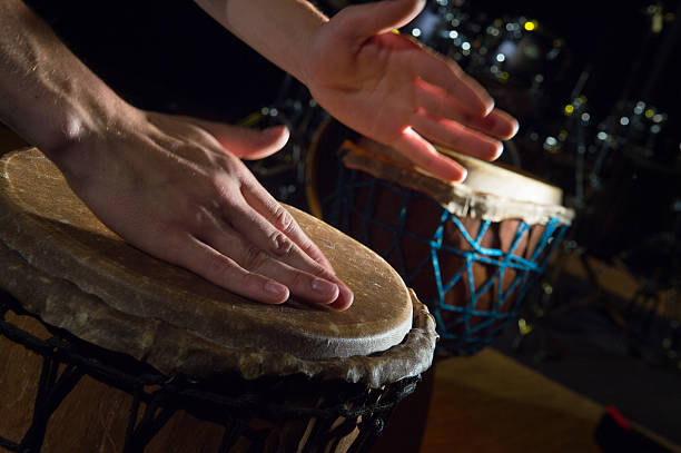 istock People hands playing music at djembe drums 621615164
