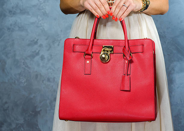istock Stylish glamorous female leather bag on grey background. 621615236