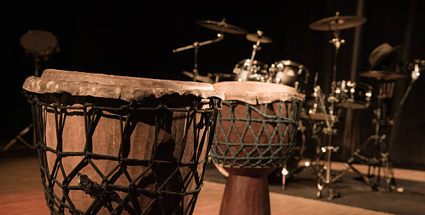 istock Traditional wooden african djembe drumon stage 621615442