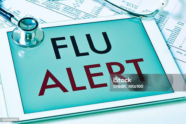 Text Flu Alert In A Tablet Computer Stock Photo - Download Image Now - Flu Virus, Cold And Flu, Season