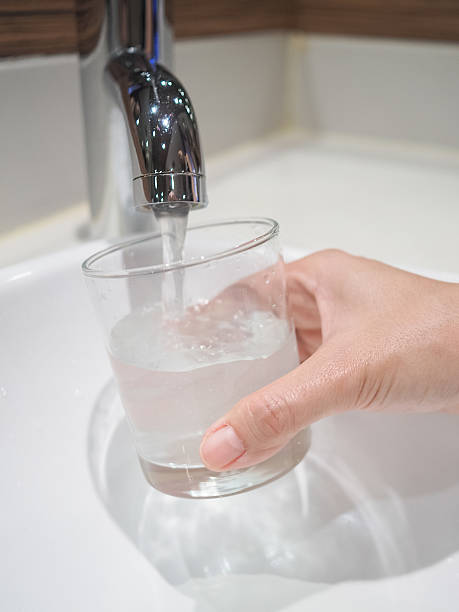 istock Filling A Glass Of Water From Tap 621685994
