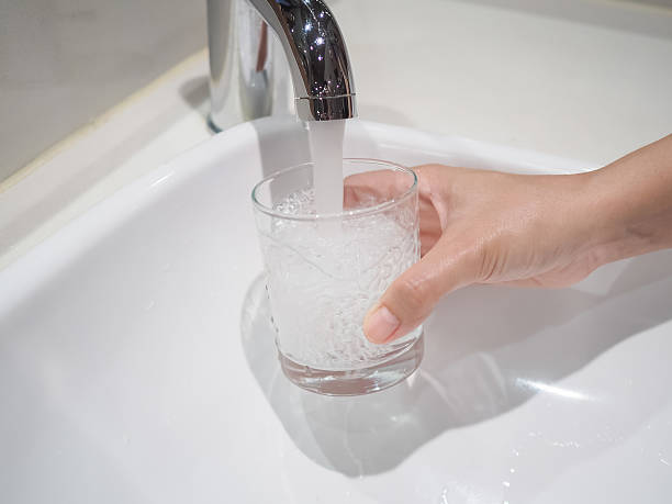 istock Filling A Glass Of Water From Tap 621686078