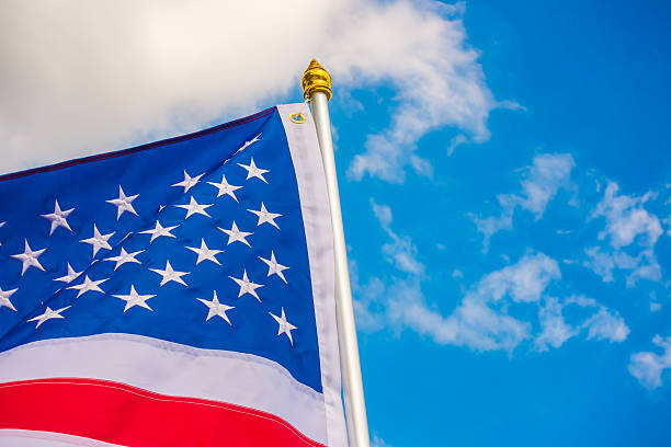 istock American flag against a blue sky 621686366