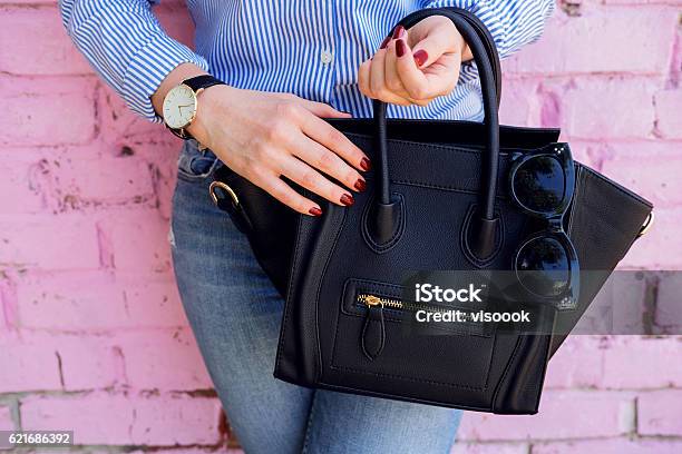 Close Up Black Leather Bag In Hand Of Fashion Woman Stock Photo - Download Image Now