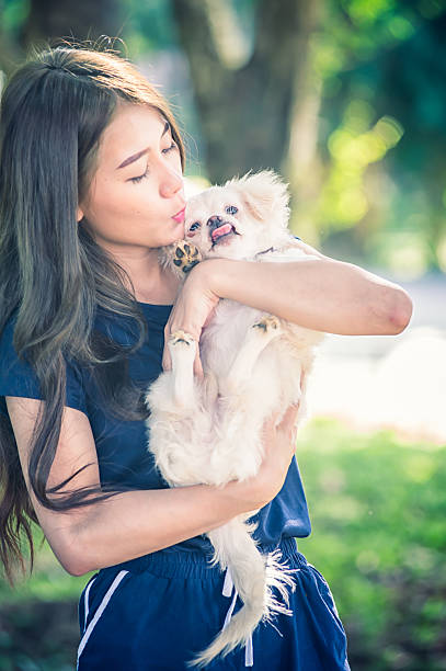 istock Happy young woman with dog 621687800