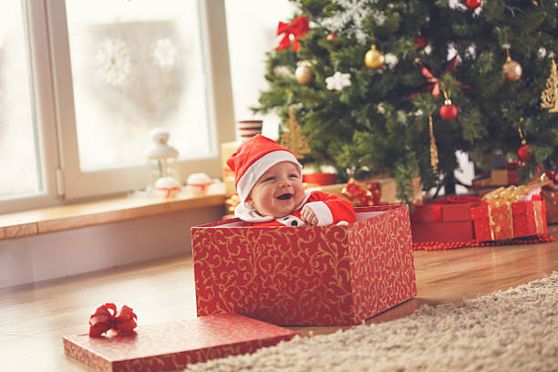 istock Baby boy in Christmas present 621688488