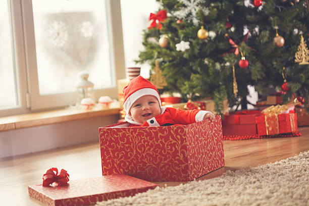 istock Baby boy in Christmas present 621688548