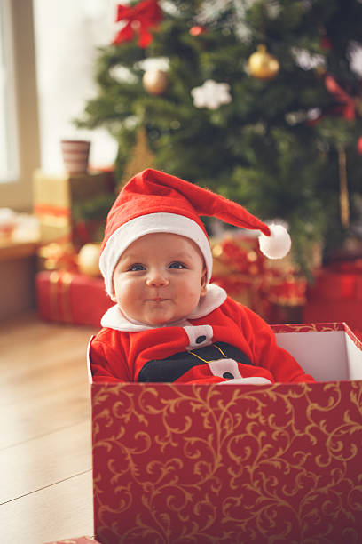 istock Baby boy in Christmas present 621688576