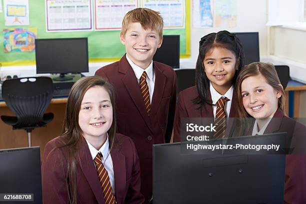 Portrait Of Elementary School Pupils In Computer Class Stock Photo - Download Image Now