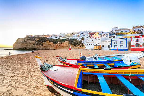 Beautiful beach in Carvoeiro, Algarve, Portugal Beautiful beach with boats in Carvoeiro, Algarve, Portugal algarve stock pictures, royalty-free photos & images