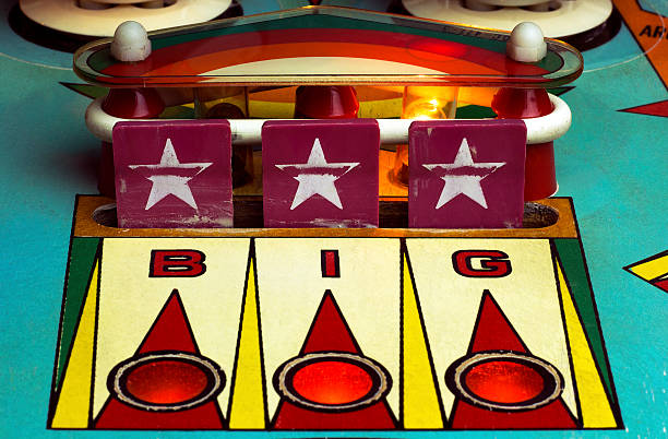 istock Star drop targets of a retro pinball machine 621691110