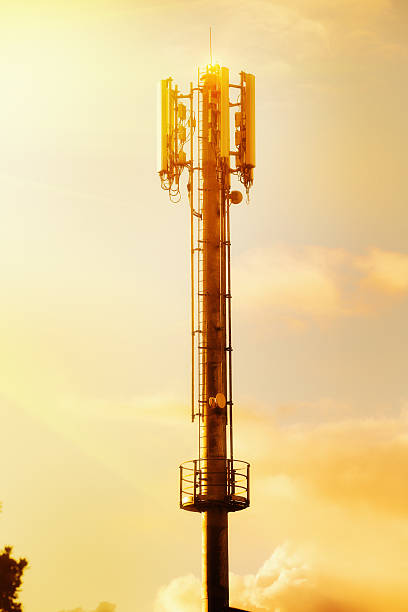 istock Early evening sunlight shines on cellphone tower 621691642