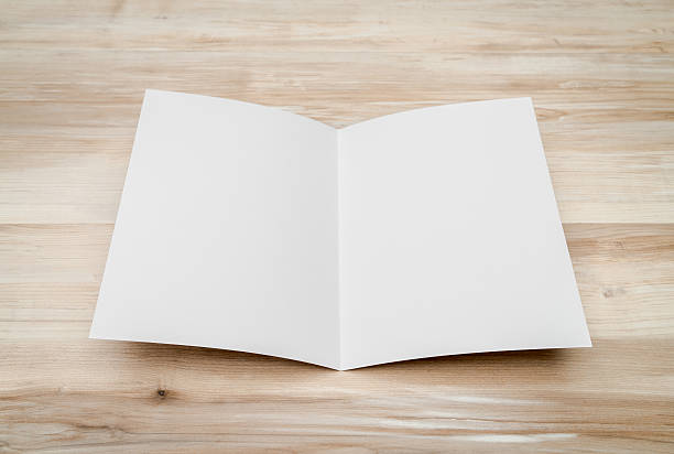 istock Blank folded paper on  wooden background 621694628