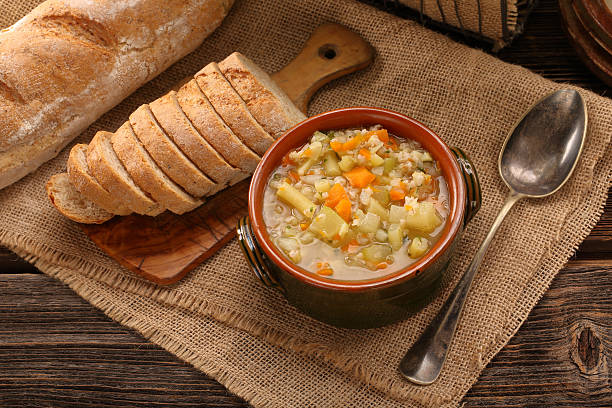 istock Autumn vegetable soup with toasts and space for text 621695292