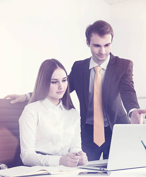 istock Businessman and businesswoman at work 621696160