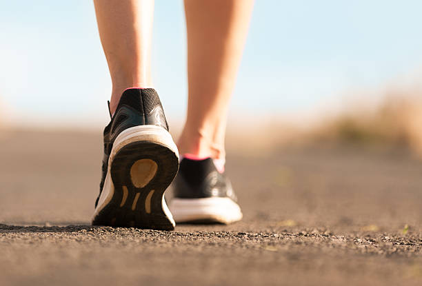 istock Pair of feet walking 621697478