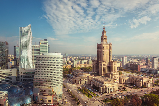 The skyline of central Warsaw at daytime. On the right stands the Palace of Culture and Science, an example of stalinist architecture from the 1950s.
