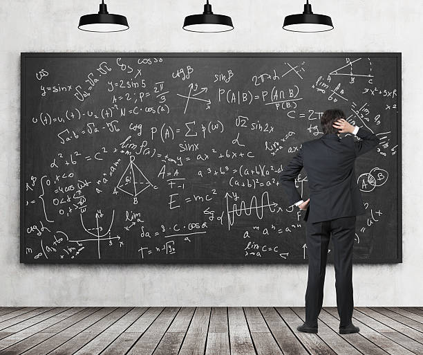 istock Man in suit looking at blackboard with formulas 621697710
