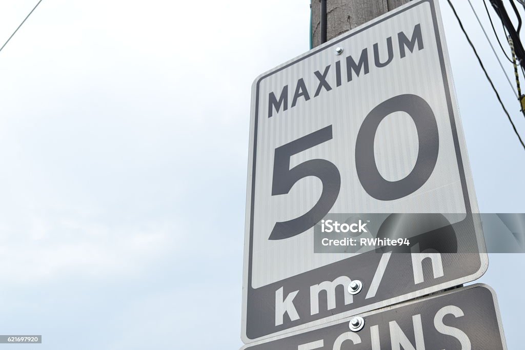 Speed Limit 50 A speed limit sign in Canada, sign states the maximum speed is 50 km/hr is that area. Speed Limit Sign Stock Photo