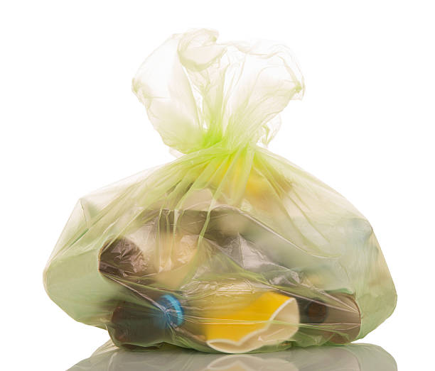 istock Transparent plastic bag with household waste isolated on white. 621698196