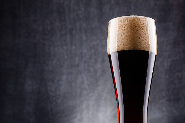 istock Tall glass of dark beer 621698354