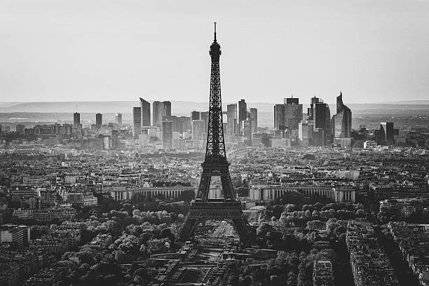 Skyline of Paris in black and white View in black and white over central Paris with the Eiffel tower in the center, and La Defense business district beyond. eiffel tower in black and white stock pictures, royalty-free photos & images