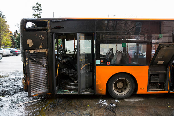 Burnt public traffic bus Burnt public traffic bus is seen on the street after caught in fire during travel and extinguished by firefighters. burned corpse stock pictures, royalty-free photos & images