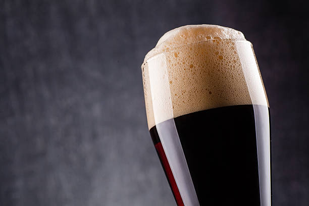 istock Tall glass of dark beer 621698554