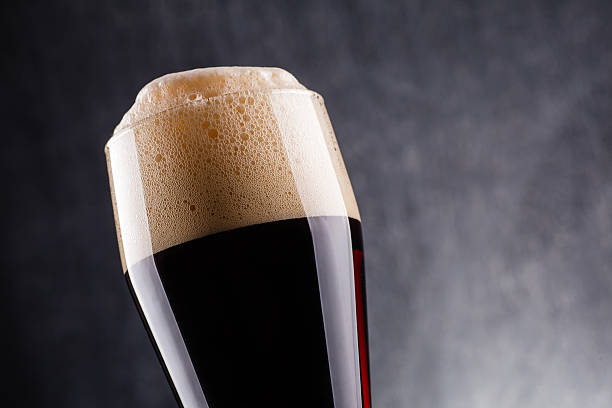 istock Tall glass of dark beer 621698640