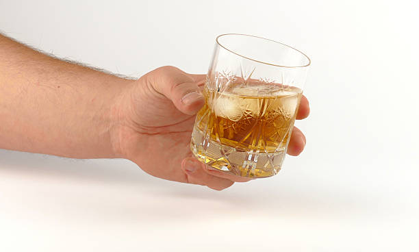 istock Glass of whiskey isolated on white background 621700464