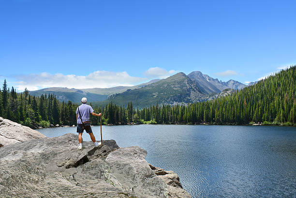 istock Man enjoying time  on hiking trip in mountains. 621701528
