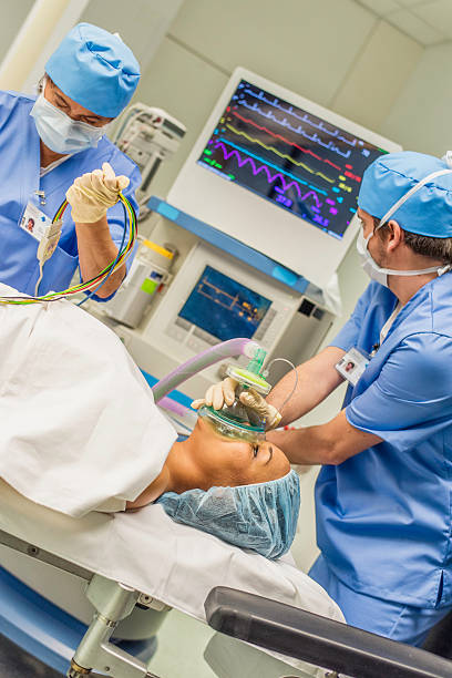 istock ER team helping a wounded young woman 621701748