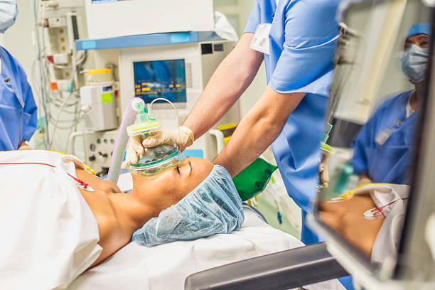 istock Young woman with oxygen mask in the emergency room 621701842