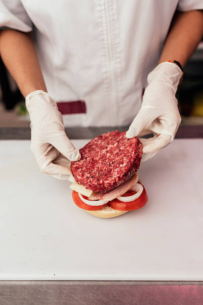 istock Chef cooking and decorated Hamburger. 621702560