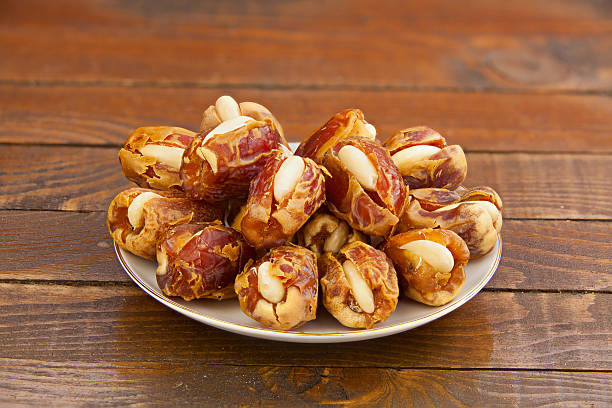 istock Delicious ripe figs on  plate lying on  wooden background 621702954