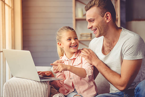 istock Father and daughter at home 621704960
